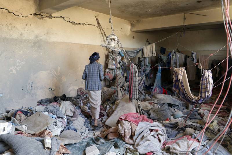 A Yemeni man inspects a site reported to be a prison destroyed in a Saudi-led air strike in the Houthi stronghold of Saada, northern Yemen, on January 27. AFP
