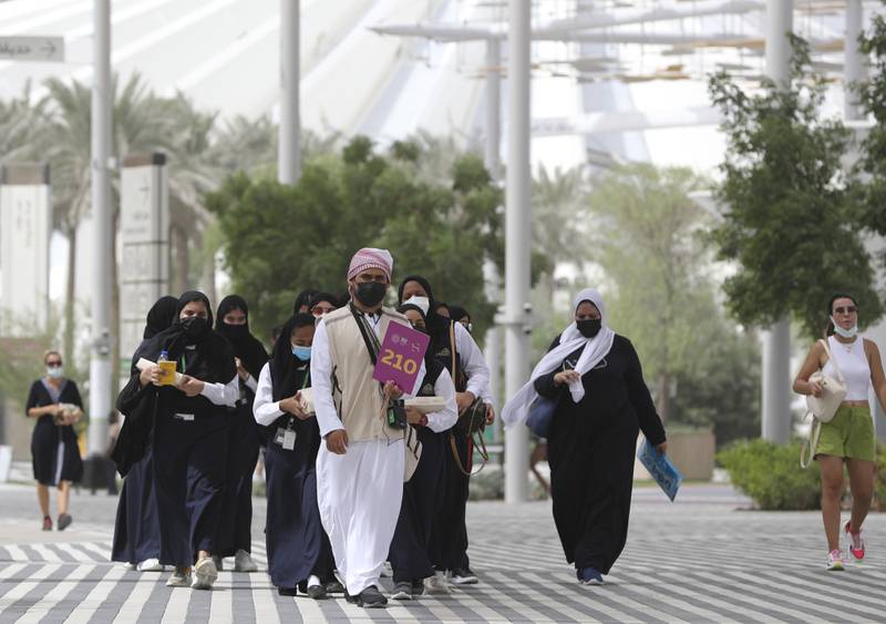 Students follow their guide during a visit to the Dubai Expo 2020, in Dubai, on October 3, 2021. AP