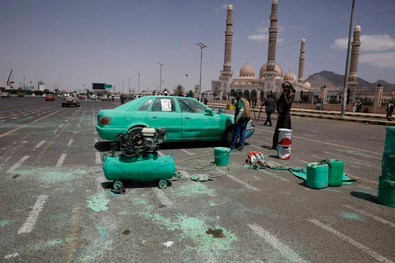 A Yemeni decorates a vehicle before celebrations begin for the birthday of the Prophet Mohammed. EPA