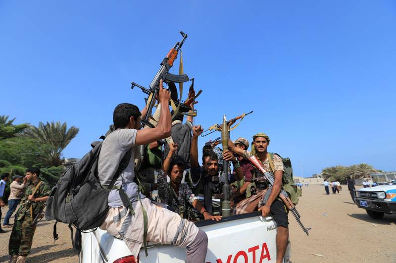 FILE PHOTO: Houthi militants ride on the back of a truck as they withdraw, part of a U.N.-sponsored peace agreement signed in Sweden, from the Red Sea city of Hodeidah, Yemen December 29, 2018. REUTERS/Abduljabbar Zeyad/File Photo