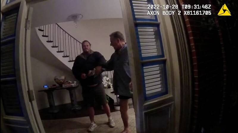 A screenshot from a police body camera video shows David DePape and Paul Pelosi. Reuters