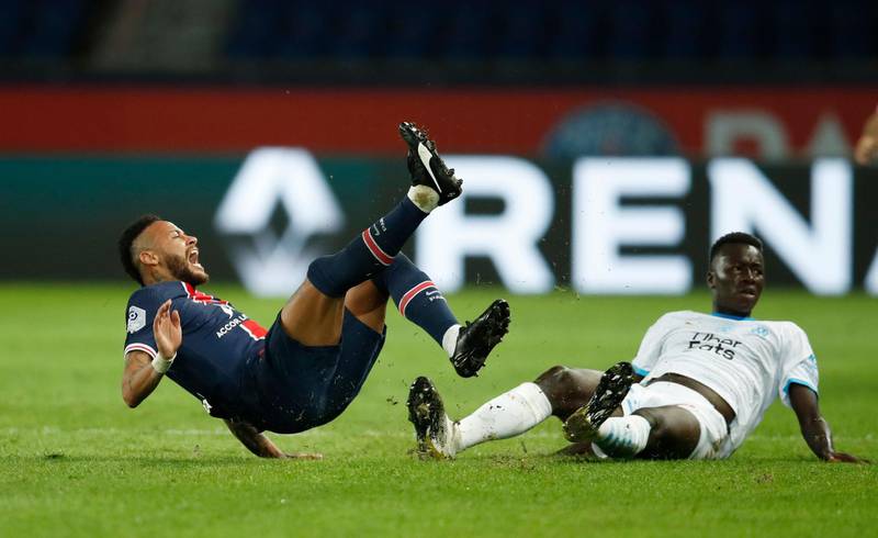 Marseille's Pape Gueye fouls PSG star Neymar. Reuters