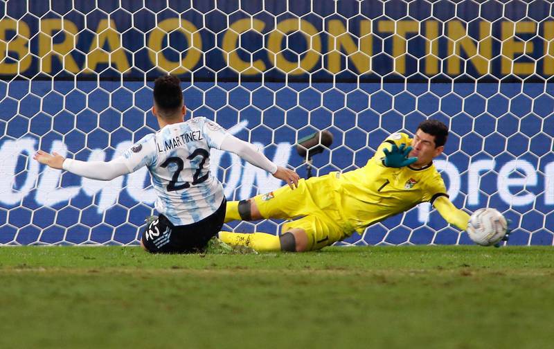 Argentina's Lautaro Martinez score against Bolivia's goalkeeper Carlos Lampe. AFP