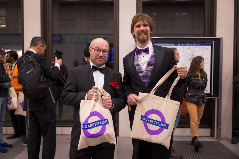 Passengers hold Elizabeth Line branded bags at Bond Street. TFL