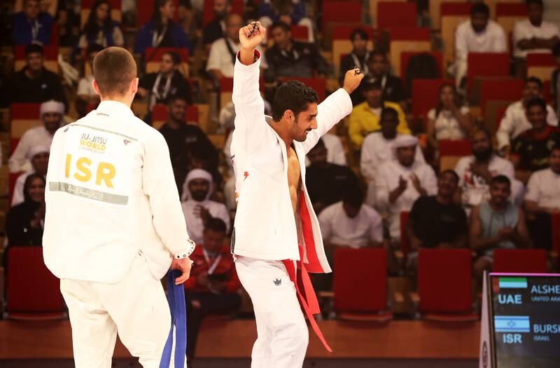 UAE's Khaled Al Shehhi from UAE (red) beat Amitmeir Burshtein from Israel (blue) in the 62 kg final. Pawan Singh / The National