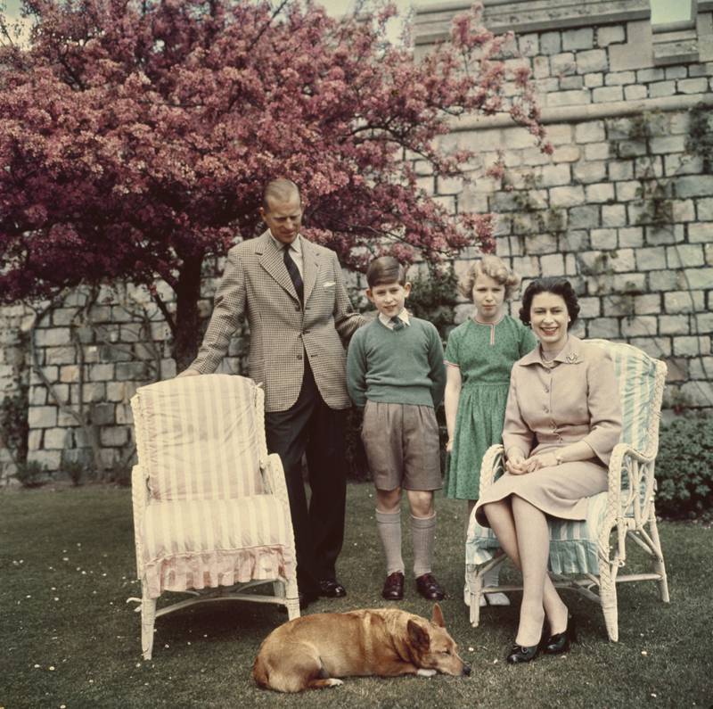 Prince Philip, Prince Charles, Princess Anne and Queen Elizabeth in the gardens of Windsor Castle in 1959. 