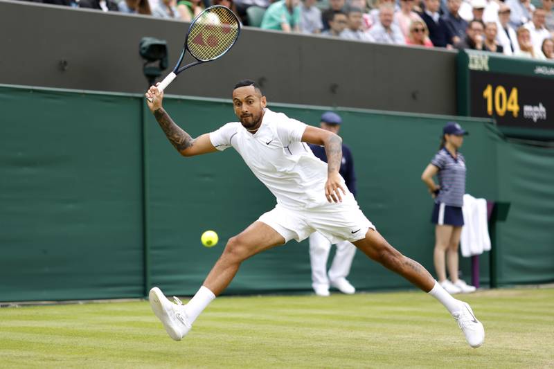 Australia's Nick Kyrgios returns to Serbia's Filip Krajinovic on his way to a straight-sets victory in their second-round singles match on day four of the Wimbledon Championships in London, on Thursday, June 30, 2022. AP