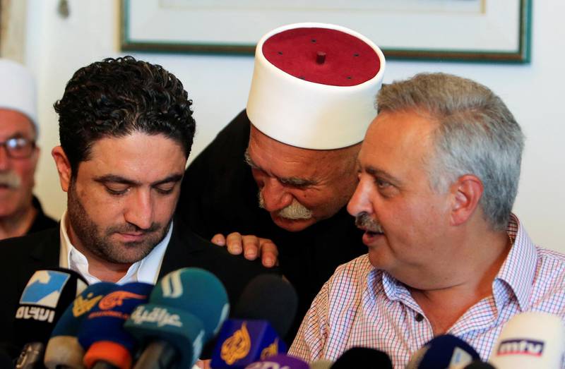 Saleh al-Gharib, the state minister for refugee affairs, whose two bodyguards were killed yesterday in what he termed an attempted assassination, sits with Talal Arslan, a Druze politician, during a news conference, in Khaldeh, near Beirut, Lebanon July 1, 2019. REUTERS/Aziz Taher