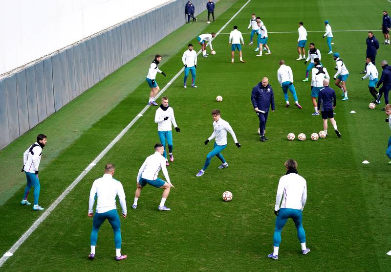 Manchester City players on the training pitch. PA