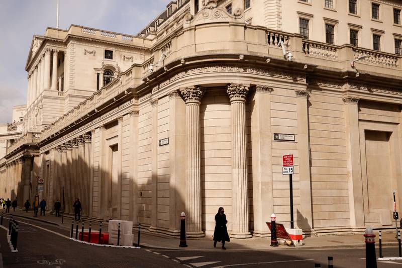 A pedestrian crosses a road near the Bank of England in London, U.K., on Thursday, May 6, 2021. The U.K.'s economic rebound from the pandemic is already fueling speculation that Bank of England policy makers this week will start discussing how and when they can ease their foot off the stimulus pedal. Photographer: Jason Alden/Bloomberg