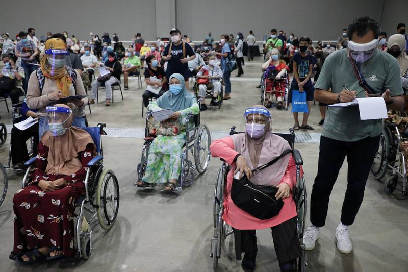 Vulnerable people await Covid-19 vaccinations at a centre in Kuala Lumpur, Malaysia. Reuters