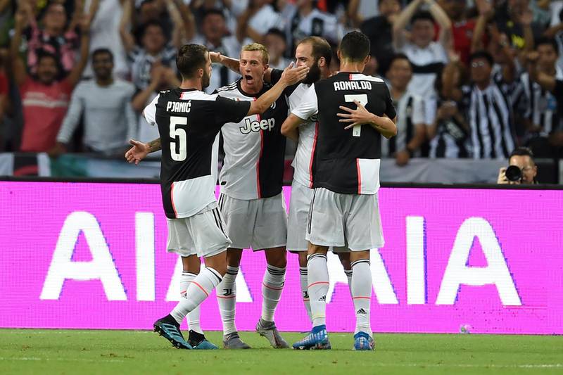 Juventus players celebrate Gonzalo Higuain's goal. AFP