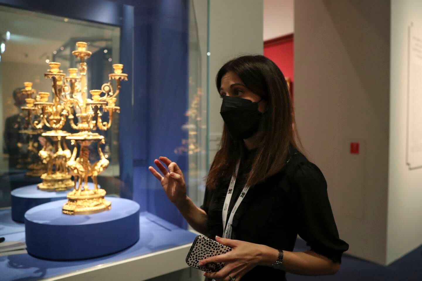 Curator Helene Delalex talks about the ostrich candelabra from the second Turkish cabinet of the Count of Artois, brother of Louis XVI. Khushnum Bhandari / The National 
