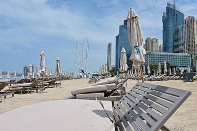 Sunbeds are seen empty at the Jumeirah Beach Residence in Dubai following the closure of all beaches by authorities.  AFP