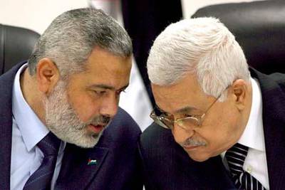 epa02705269 (FILE) A file photograph dated 18 March 2007 shows Palestinian President Mahmoud Abbas (R) with Palestinian Prime Minister Ismail Haniyeh during a government cabinet meeting in Gaza City in the Gaza Strip. After years of dispute, rival Palestinian factions Hamas and Fatah signed a reconciliation agreement mediated by Egypt in Cairo on 27 April 2011, Fatah officials confirmed. The details of the surprise agreement would be revealed in a press conference in Cairo later on Wednesday, Fatah official Azzam al-Ahmad, who led his groupÔs delegation in the talks said. The deal creates a timeframe for legislative and presidential elections and calls for the formation of an interim government, panArab network Al Arabiya reported earlier.  EPA/ALI ALI