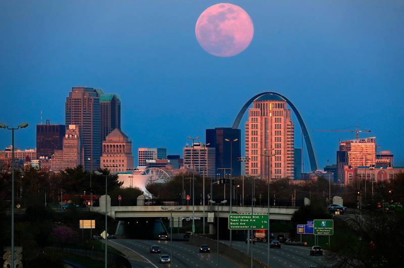 The pink supermoon rises over St. Louis. April's supermoon is the brightest and largest it will be for all of 2020.  AP