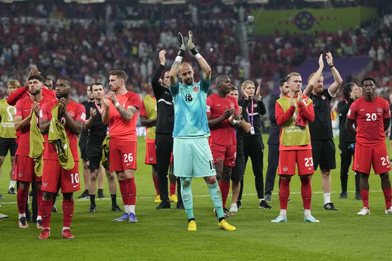 Canada goalkeeper Milan Borjan and his team applaud their fans after elimination. AP