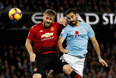 Manchester United's Luke Shaw in action with Manchester City's Ilkay Gundogan. Reuters