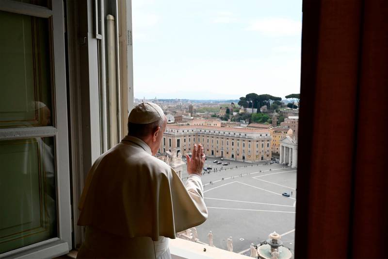 This photo taken and released on April 13, 2020 by the Vatican Media shows Pope Francis deliver his blessing from the window of the Apostolic palace after deliver his message during a private Angelus prayer live broadcast from the palace's library in the Vatican on Easter Monday, during the lockdown aimed at curbing the spread of the COVID-19 infection, caused by the novel coronavirus.  RESTRICTED TO EDITORIAL USE - MANDATORY CREDIT "AFP PHOTO / VATICAN MEDIA" - NO MARKETING - NO ADVERTISING CAMPAIGNS - DISTRIBUTED AS A SERVICE TO CLIENTS
 / AFP / VATICAN MEDIA / Handout / RESTRICTED TO EDITORIAL USE - MANDATORY CREDIT "AFP PHOTO / VATICAN MEDIA" - NO MARKETING - NO ADVERTISING CAMPAIGNS - DISTRIBUTED AS A SERVICE TO CLIENTS
