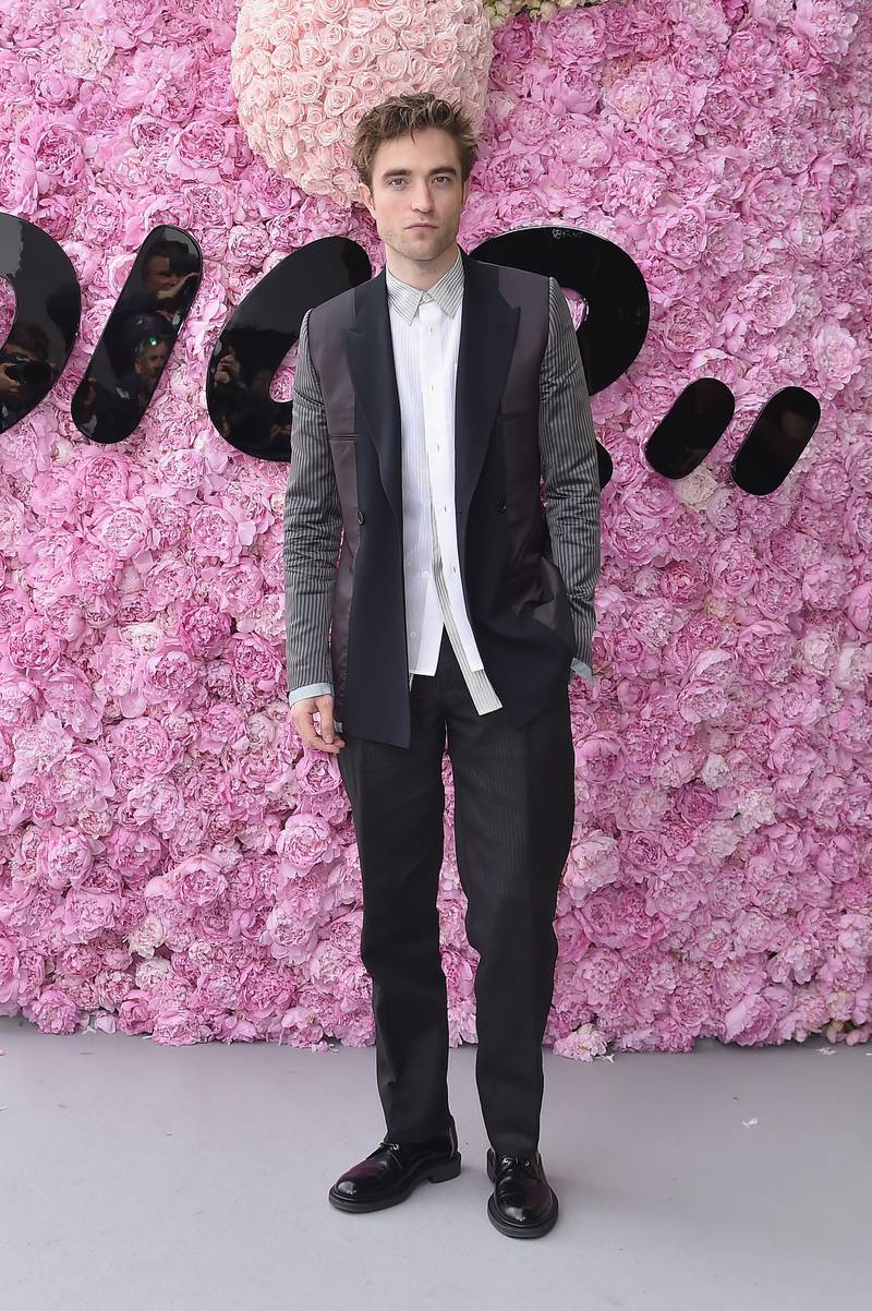 Robert Pattinson, in layered Dior, attends the brand's Dior Homme Menswear spring/summer 2019 show as part of Paris Fashion Week on June 23, 2018. Getty Images