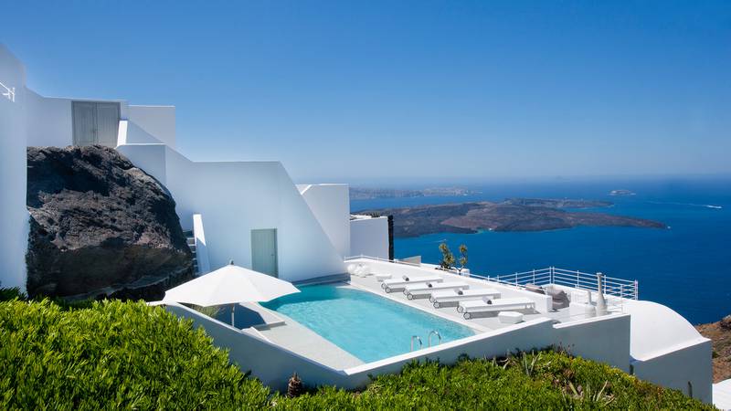Santorini is known for its white buildings and epic sea views. Photo: Auberge Resorts