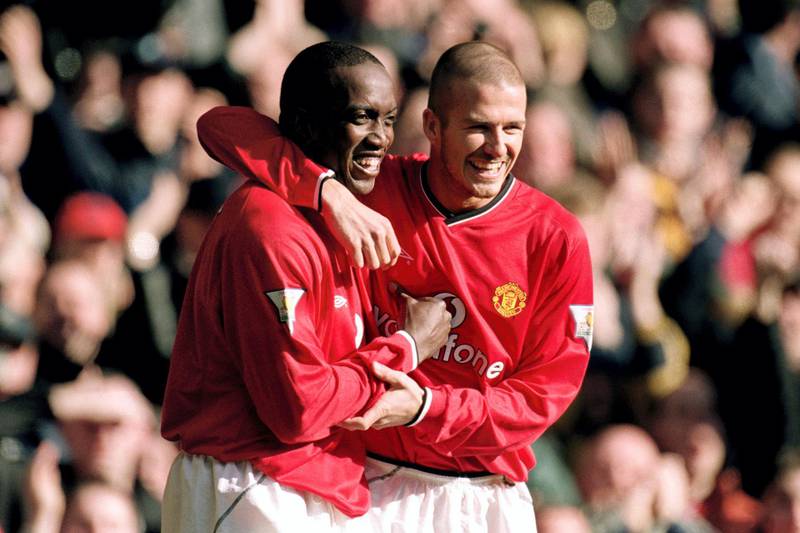 Manchester United's Dwight Yorke celebrates his first goal with teammate David Beckham  (Photo by Neal Simpson/EMPICS via Getty Images)