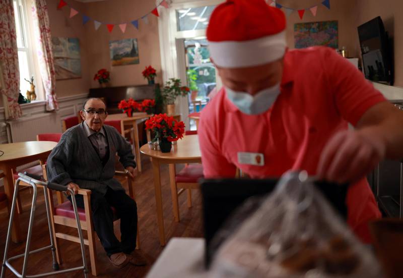 A resident waits to speak to his family via Zoom from Alexander House Care Home in Wimbledon, London. Reuters