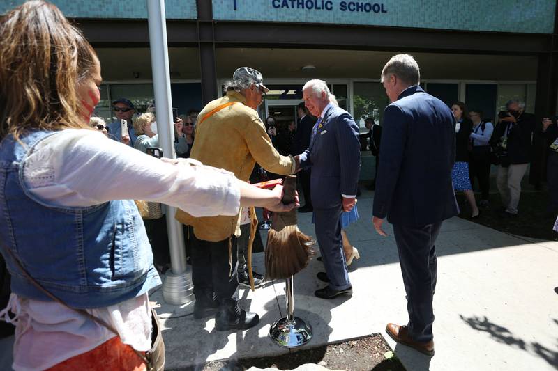 Britain's Prince Charles greets member of the public during a visit at Assumption Catholic school May 18, 2022 in Ottawa. AFP