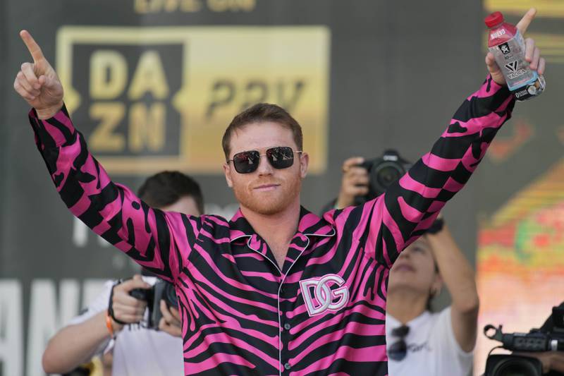 Saul Alvarez motions to the crowd during the weigh-in. AP