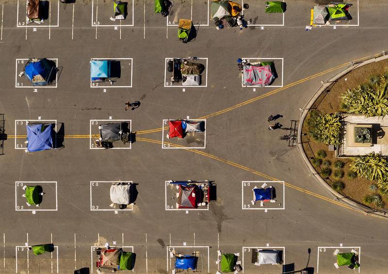 Rectangles designed to help prevent the spread of the coronavirus by encouraging social distancing are drawn in a city-sanctioned homeless encampment at San Francisco's Civic Centre on May 21, 2020. AP Photo