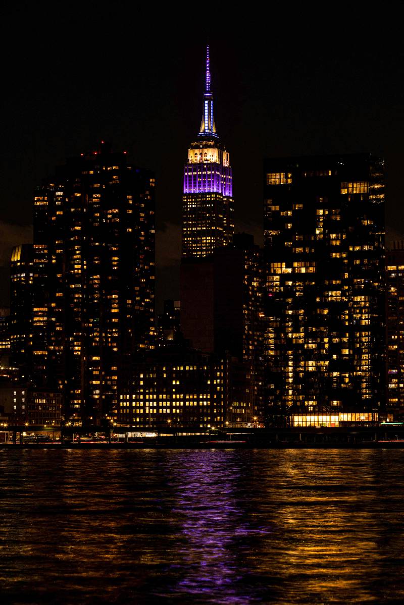The Empire State Building in New York is lit in purple in celebration of the life and legacy of the late Queen Elizabeth. AFP