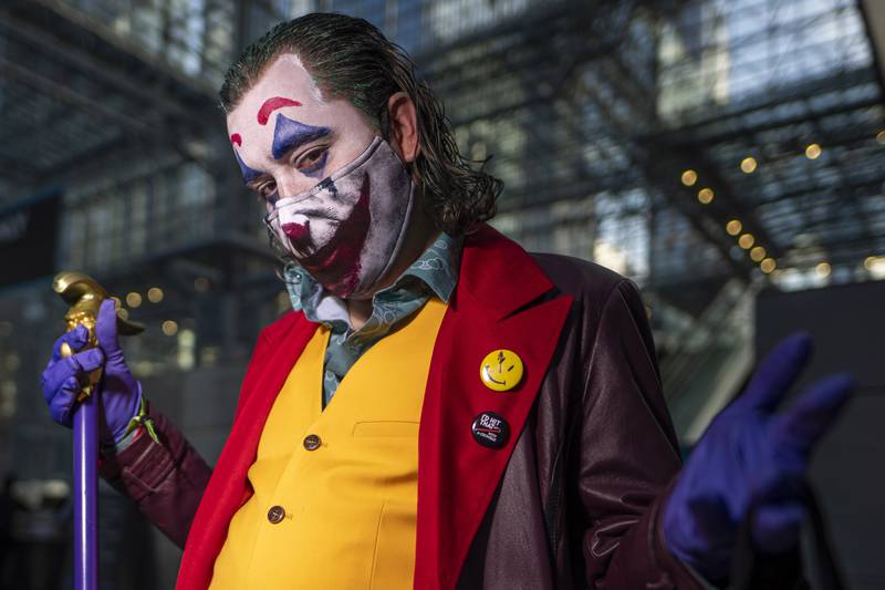 A Joker cosplayer poses during New York Comic Con. Charles Sykes / Invision / AP