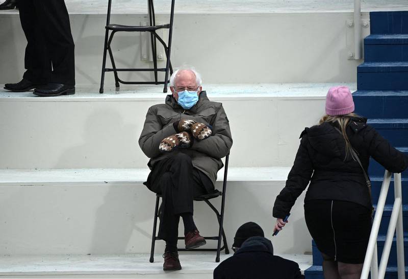 Former presidential candidate, Senator Bernie Sanders (D-Vermont) sits in the bleachers on Capitol Hill before Joe Biden is sworn in as the 46th US President on January 20, 2021, at the US Capitol in Washington, DC. (Photo by Brendan SMIALOWSKI / AFP)