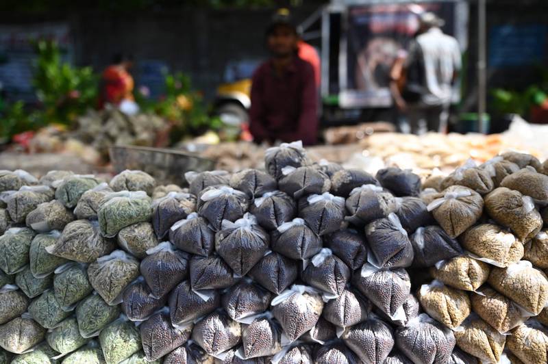 Pulses packed in single-use plastic bags at a market stall in Chennai. AFP