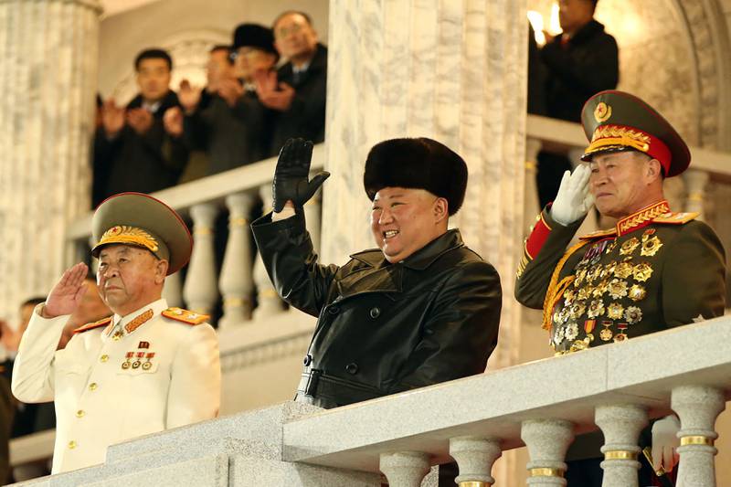 Kim Jong-un is all smiles as he watches the military parade in the North Korean capital Pyongyang. AFP