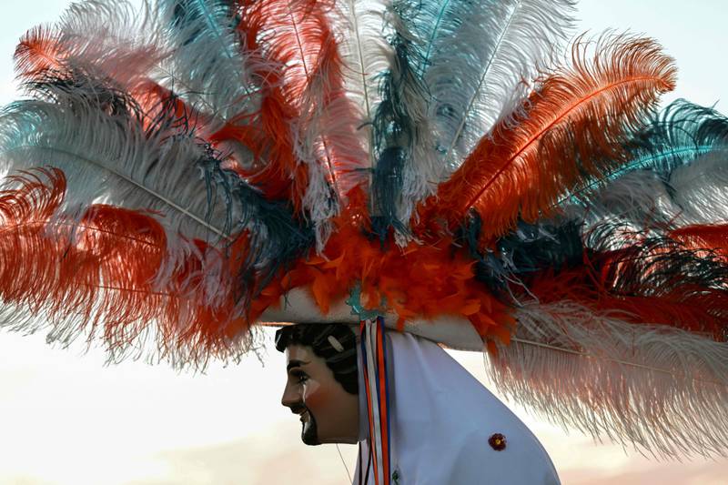A man wears a traditional feathered 'huehue' costume in Tlaxcala state, Mexico. AFP