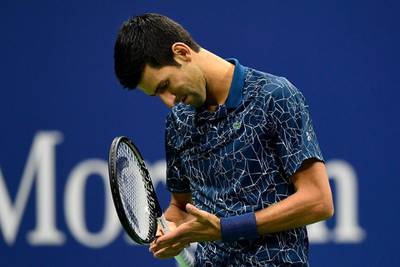 Novak Djokovic of Serbia reacts during his men's Singles finals match against Juan Martin del Potro of Argentina.  AFP