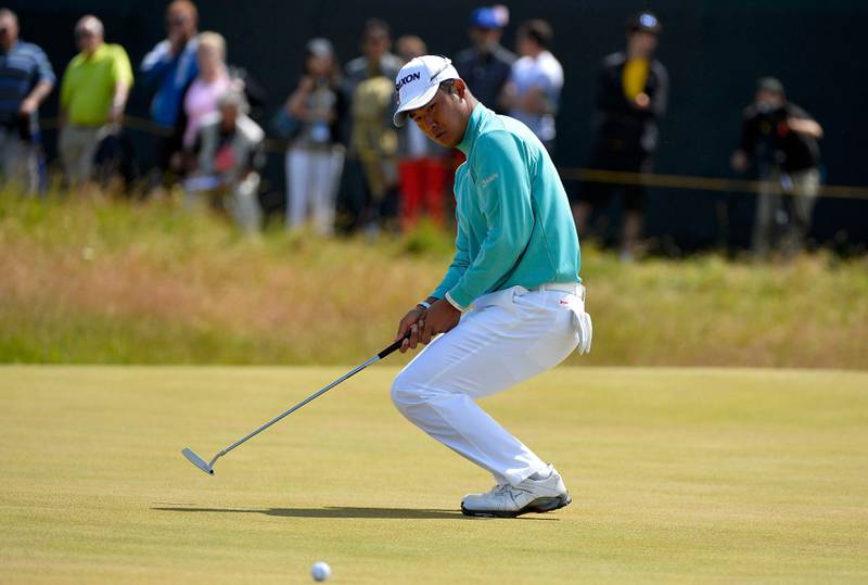 Hideki Matsuyama of Japan reacts after missing his birdie putt on the first green during the final round of the British Open golf championship at Muirfield in Scotland July 21, 2013.   REUTERS/Toby Melville (BRITAIN  - Tags: SPORT GOLF)   *** Local Caption ***  LON703_GOLF-OPEN-_0721_11.JPG