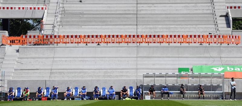 The Karlsruhe bench with players and team members keeping the required distance during the German Bundesliga second division soccer match between Karlsruher and Darmstadt 98 at Wildparkstadion in Karlsruhe, Germany.  EPA