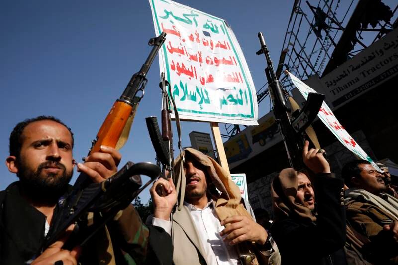 Pro-Houthis Yemenis hold up weapons during an anti-US and Saudi Arabia rally in Sana'a, Yemenon 7 March 2022. EPA