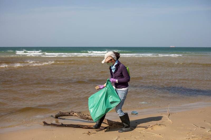 Other Fischzang cleans tar after an oil spill in the Mediterranean Sea, in Michmoret, Israel. A disastrous oil spill has blackened most of the country's shoreline and reached beaches of neighboring Lebanon. The cleanup is expected to take months. AP Photo