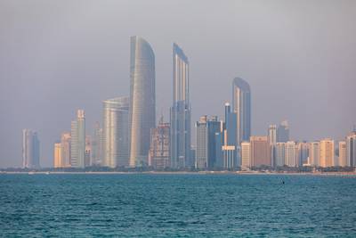 Commercial and residential skyscrapers stand along the coastline in Abu Dhabi, United Arab Emirates, on Wednesday, Oct. 2, 2019. Abu Dhabi sold $10 billion of bonds in a three-part deal in its first international offering in two years as it takes advantage of relatively low borrowing costs. Photographer: Christopher Pike/Bloomberg