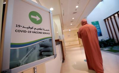 epa08906848 A woman walks where the Pfizer-BioNTech COVID-19 vaccine is administered at Zabeel Health Center in Dubai, United Arab Emirates, 27 December 2020. The Gulf emirate of Dubai has started to give the Pfizer-BioNTech COVID-19 vaccine to people on 23 December 2020.  EPA/ALI HAIDER