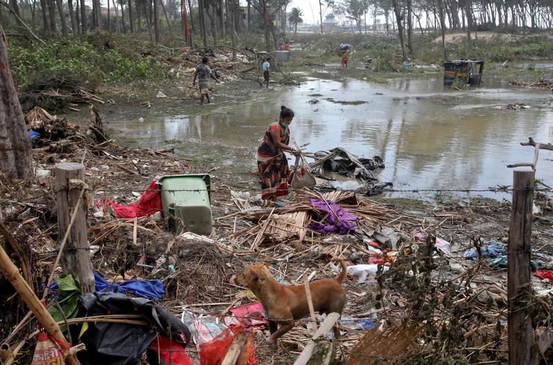 Residents of Purba Medinipur district in West Bengal salvage belongings after Cyclone Yaas struck. Reuters