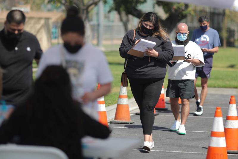 People queue for vaccinations in Artesia, California. Reuters