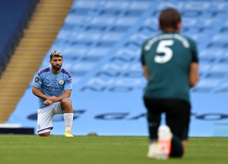 Manchester City striker Sergio Aguero and Burnley defender James Tarkowski take a knee in support of the Black Lives Matter movement.