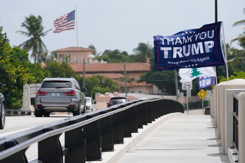 A flag flies in the air near former President Donald Trump's Mar-a-Lago estate. AP