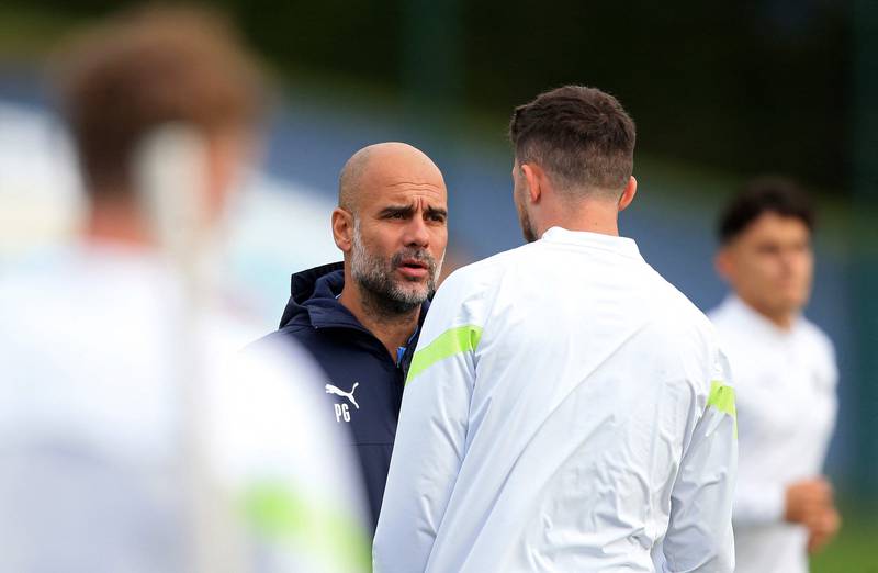 Manchester City manager Pep Guardiola passes on instructions during a training session. AFP