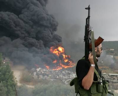 A Hezbollah gunman in a Beirut suburb, July 17, 2006