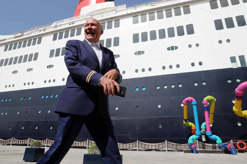 DUBAI , UNITED ARAB EMIRATES ,  October 15 , 2018 :- Peter Warwick, ex cruise director of the QE2 talking about some of his old memories during the interview near the Queen Elizabeth 2 ship in Dubai. ( Pawan Singh / The National )  For Weekend. Story by Hala Khalaf